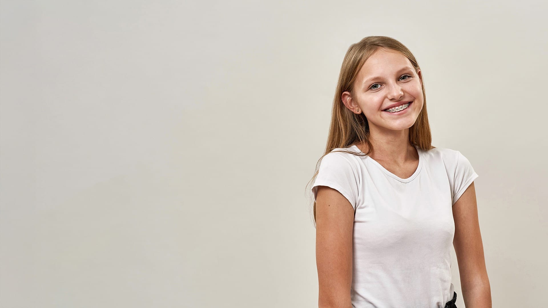 Teen with braces smiling